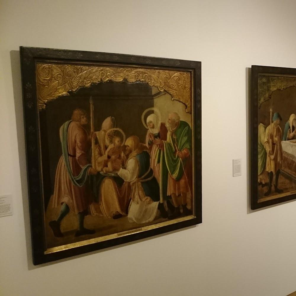 A framed painting of a religious scene.